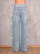 Jean azul claro Cinder de DAVD en vista lateral, silueta amplia y caída recta en denim azul claro.