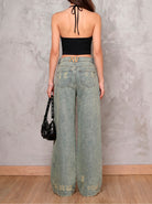 Jean azul wide leg Sulfur de DAVD en vista posterior, silueta amplia con bolsillos traseros y acabado desgastado.