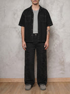 Jean negro wide leg Obsidian de DAVD en versión masculina, silueta unisex amplia en denim negro.