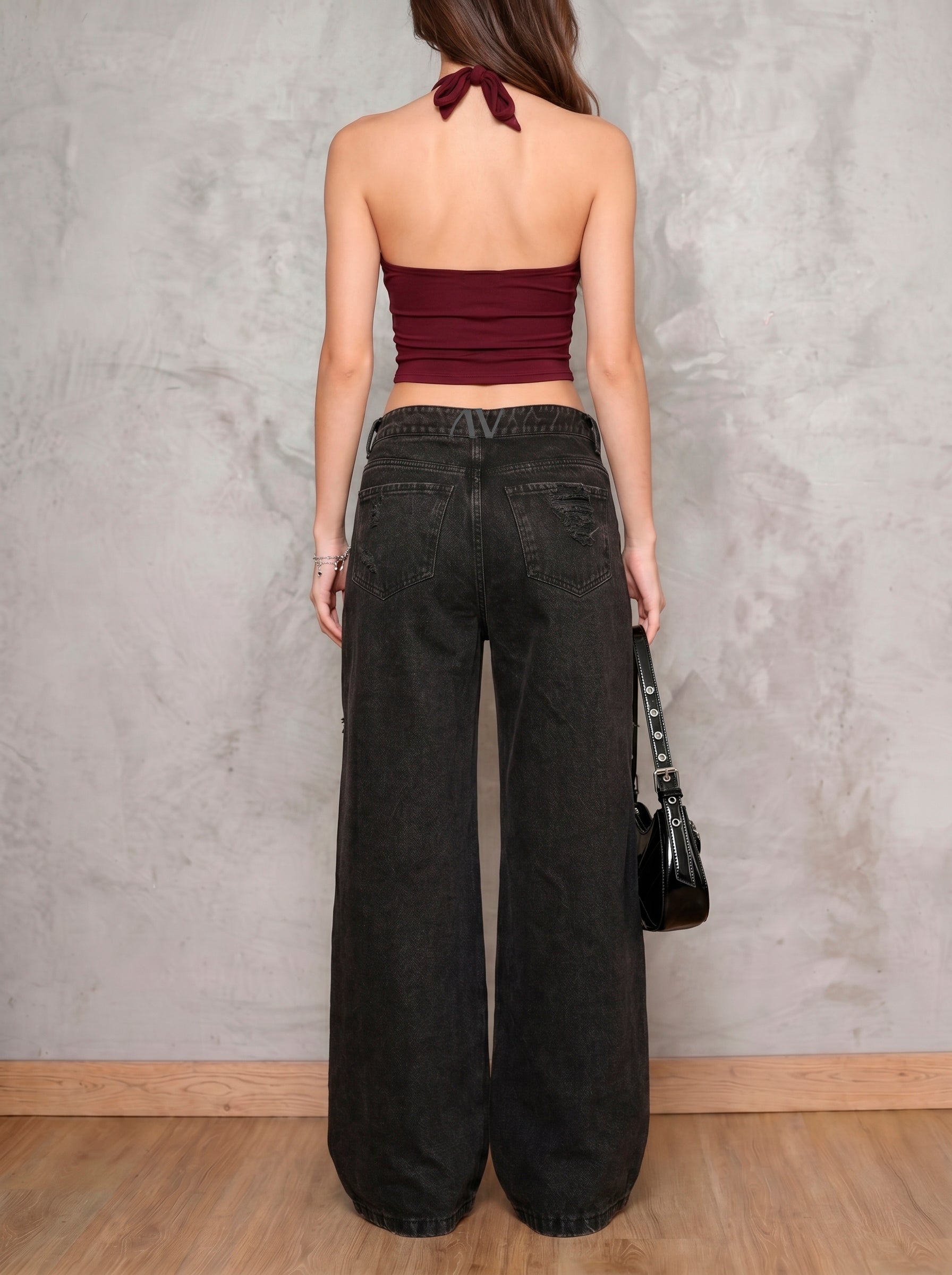 Jean negro wide leg Obsidian de DAVD en vista posterior, denim negro con caída amplia y bolsillos traseros.